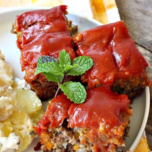 Cheesy Meatloaf | Can't Stay Out of the Kitchen | This amazing #meatloaf is filled with #cheddarcheese & topped with a #ketchup, mustard & brown sugar topping. This #glutenfree #entree uses #oatmeal & GF bread crumbs. #beef #groundbeef