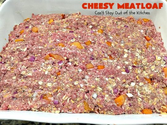 Cheesy Meatloaf | Can't Stay Out of the Kitchen | This amazing #meatloaf is filled with #cheddarcheese & topped with a #ketchup, mustard & brown sugar topping. This #glutenfree #entree uses #oatmeal & GF bread crumbs. #beef #groundbeef