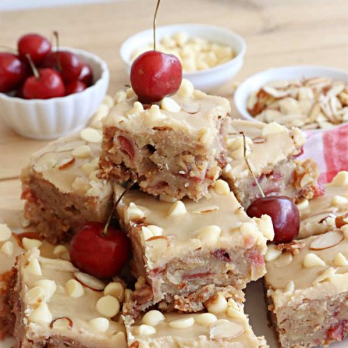 Cherry Almond Blondies | Can't Stay Out of the Kitchen | You'll be swooning from the first bite of these luscious bar-type #cookies. Browned butter in the cookie as well as the icing sets these #blondies apart. They're rich, decadent & so heavenly they'll cure any sweet tooth craving. Great for #tailgating parties & potlucks. #cherries #almonds #VanillaChips #CherryAlmondBlondies
