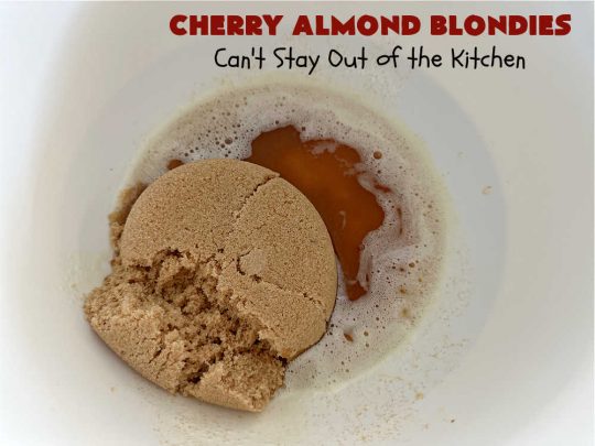 Cherry Almond Blondies | Can't Stay Out of the Kitchen | You'll be swooning from the first bite of these luscious bar-type #cookies. Browned butter in the cookie as well as the icing sets these #blondies apart. They're rich, decadent & so heavenly they'll cure any sweet tooth craving. Great for #tailgating parties & potlucks. #cherries #almonds #VanillaChips #CherryAlmondBlondies