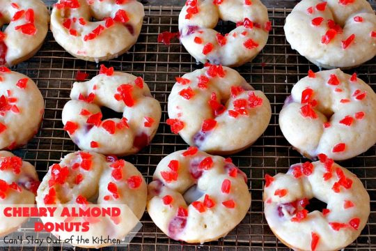 Cherry Almond Donuts | Can't Stay Out of the Kitchen | these luscious #donuts are filled with #cherries & #almond extract. They're glazed with an almond-flavored powdered sugar icing & topped with chopped cherries. Perfect for #ValentinesDay or any #holiday #breakfast. #HolidayBreakfast #ValentinesDayBreakfast #CherryDonuts #CherryAlmondDonuts 