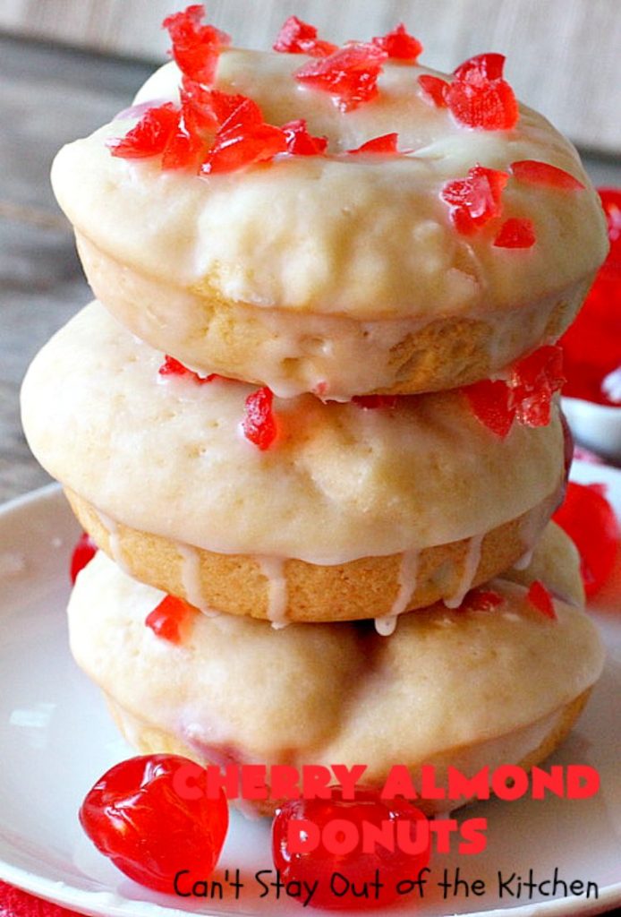 Cherry Almond Donuts | Can't Stay Out of the Kitchen | these luscious #donuts are filled with #cherries & #almond extract. They're glazed with an almond-flavored powdered sugar icing & topped with chopped cherries. Perfect for #ValentinesDay or any #holiday #breakfast. #HolidayBreakfast #ValentinesDayBreakfast #CherryDonuts #CherryAlmondDonuts 