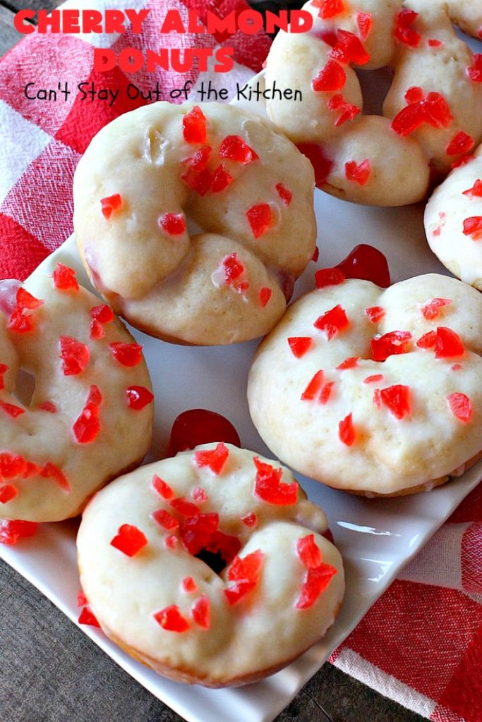 Cherry Almond Donuts | Can't Stay Out of the Kitchen | these luscious #donuts are filled with #cherries & #almond extract. They're glazed with an almond-flavored powdered sugar icing & topped with chopped cherries. Perfect for #ValentinesDay or any #holiday #breakfast. #HolidayBreakfast #ValentinesDayBreakfast #CherryDonuts #CherryAlmondDonuts 