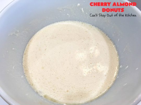Cherry Almond Donuts | Can't Stay Out of the Kitchen | these luscious #donuts are filled with #cherries & #almond extract. They're glazed with an almond-flavored powdered sugar icing & topped with chopped cherries. Perfect for #ValentinesDay or any #holiday #breakfast. #HolidayBreakfast #ValentinesDayBreakfast #CherryDonuts #CherryAlmondDonuts 