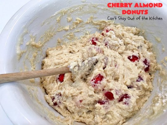 Cherry Almond Donuts | Can't Stay Out of the Kitchen | these luscious #donuts are filled with #cherries & #almond extract. They're glazed with an almond-flavored powdered sugar icing & topped with chopped cherries. Perfect for #ValentinesDay or any #holiday #breakfast. #HolidayBreakfast #ValentinesDayBreakfast #CherryDonuts #CherryAlmondDonuts 