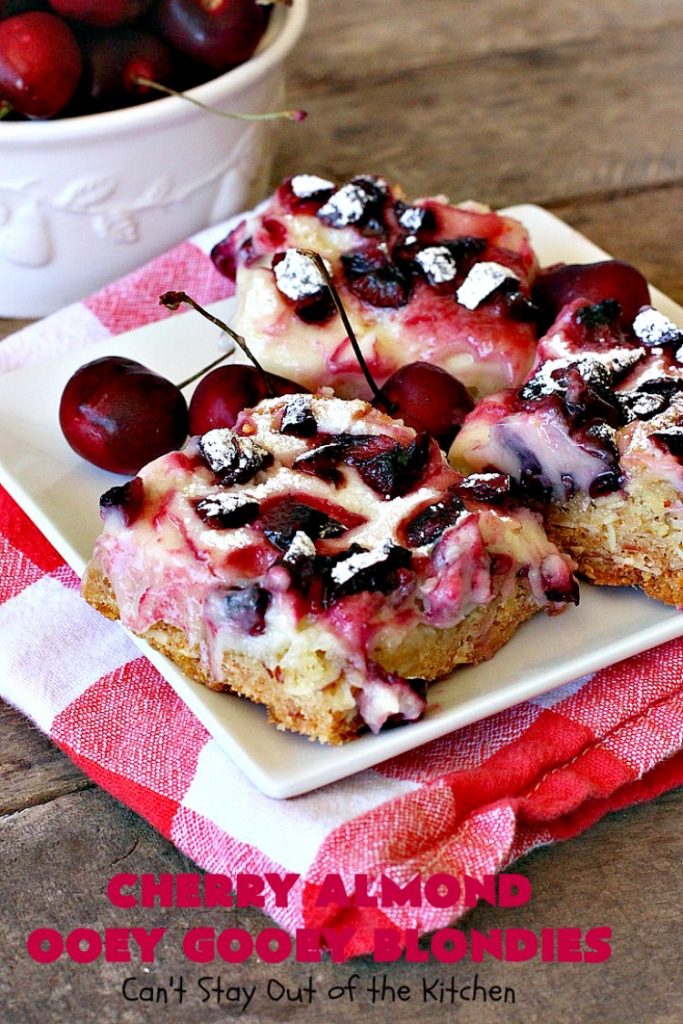 Cherry Almond Ooey Gooey Blondies | Can't Stay Out of the Kitchen | Best #cherry #dessert ever! These fabulous #cookies have a #cheesecake filling, topped with fresh #cherries & powdered sugar. They are absolutely heavenly. #almonds #cherrydessert #Canbassador #NorthwestCherryGrowers