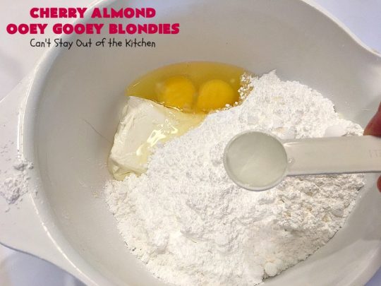 Cherry Almond Ooey Gooey Blondies | Can't Stay Out of the Kitchen | Best #cherry #dessert ever! These fabulous #cookies have a #cheesecake filling, topped with fresh #cherries & powdered sugar. They are absolutely heavenly. #almonds #cherrydessert #Canbassador #NorthwestCherryGrowers