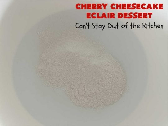 Cherry Cheesecake Éclair Dessert | Can't Stay Out of the Kitchen | this is an awesome #dessert to wow your family, friends and company for any social gathering. It's a #SixIngredientRecipe & easily whipped up in about 10 minutes. This #CherryDessert will have you swooning from the first bite. #ÉclairDessert #CherryCheesecakeÉclairDessert #Éclairs #CherryPieFilling #Cheesecake #CheesecakePuddingMix