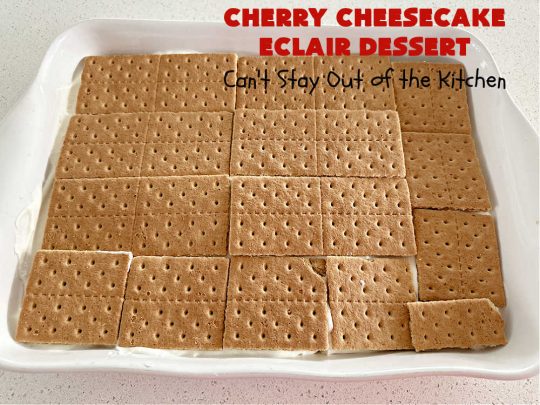 Cherry Cheesecake Éclair Dessert | Can't Stay Out of the Kitchen | this is an awesome #dessert to wow your family, friends and company for any social gathering. It's a #SixIngredientRecipe & easily whipped up in about 10 minutes. This #CherryDessert will have you swooning from the first bite. #ÉclairDessert #CherryCheesecakeÉclairDessert #Éclairs #CherryPieFilling #Cheesecake #CheesecakePuddingMix