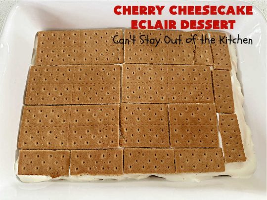 Cherry Cheesecake Éclair Dessert | Can't Stay Out of the Kitchen | this is an awesome #dessert to wow your family, friends and company for any social gathering. It's a #SixIngredientRecipe & easily whipped up in about 10 minutes. This #CherryDessert will have you swooning from the first bite. #ÉclairDessert #CherryCheesecakeÉclairDessert #Éclairs #CherryPieFilling #Cheesecake #CheesecakePuddingMix