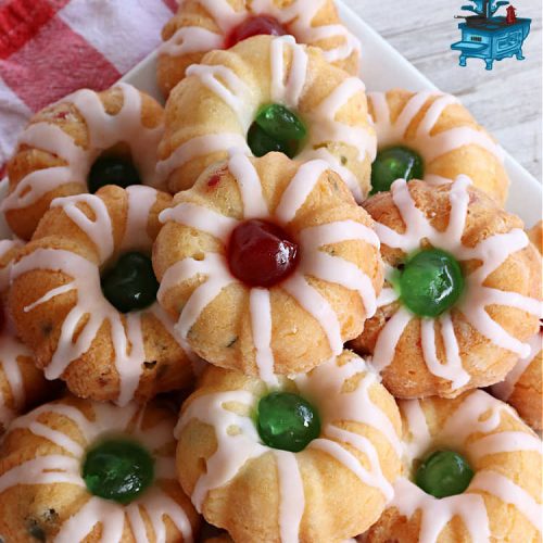 Cherry Cheesecake Tea Cakes | Can't Stay Out of the Kitchen | These miniature #Bundt #cakes will knock your socks off! They're filled with red & green #cherries & flavored with #almond extract, #CreamCheese & #Cheesecake #PuddingMix. Great #holiday or #Christmas #dessert. #CherryDessert #HolidayDessert #TeaCakes #CherryCheesecakeTeaCakes