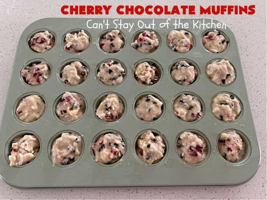 Cherry Chocolate Muffins | Can't Stay Out of the Kitchen | Every sweet tooth craving will be satisfied by one bite of these sensational #muffins. They're filled with #CandiedCherries & miniature #ChocolateChips. #Bananas & #applesauce keep the muffins moist. They're perfect for any #brunch or #breakfast #menu, as snacks to take to sports practices, for #tailgating parties or #potlucks. Everyone will want seconds. #chocolate #cherries #holiday #CherryMuffins #HolidayBreakfast #ChocolateMuffins #CherryChocolateMuffins