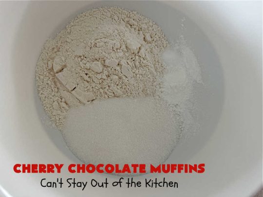 Cherry Chocolate Muffins | Can't Stay Out of the Kitchen | Every sweet tooth craving will be satisfied by one bite of these sensational #muffins. They're filled with #CandiedCherries & miniature #ChocolateChips. #Bananas & #applesauce keep the muffins moist. They're perfect for any #brunch or #breakfast #menu, as snacks to take to sports practices, for #tailgating parties or #potlucks. Everyone will want seconds. #chocolate #cherries #holiday #CherryMuffins #HolidayBreakfast #ChocolateMuffins #CherryChocolateMuffins