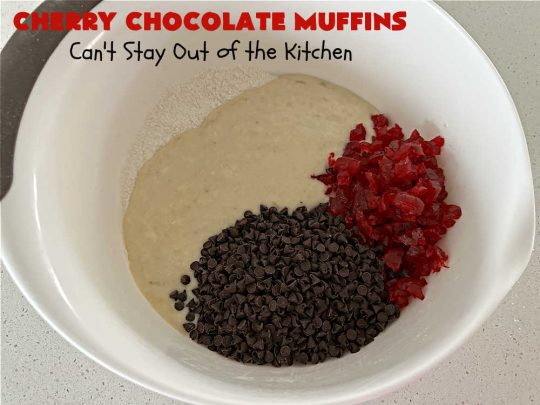 Cherry Chocolate Muffins | Can't Stay Out of the Kitchen | Every sweet tooth craving will be satisfied by one bite of these sensational #muffins. They're filled with #CandiedCherries & miniature #ChocolateChips. #Bananas & #applesauce keep the muffins moist. They're perfect for any #brunch or #breakfast #menu, as snacks to take to sports practices, for #tailgating parties or #potlucks. Everyone will want seconds. #chocolate #cherries #holiday #CherryMuffins #HolidayBreakfast #ChocolateMuffins #CherryChocolateMuffins