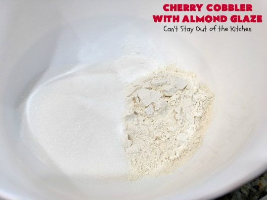Cherry Cobbler with Almond Glaze | Can't Stay Out of the Kitchen | This lovely #dessert is actually assembled in layers that you don't stir together. It's terrific for #summer #holidays, backyard BBQs & potlucks while #FreshCherries are still in season. #cherries #CherryCobbler #cobbler #CherryDessert #CherryCobblerWithAlmondGlaze #Canbassador #NWCherries #NorthWestCherryGrowers #FavoriteCherryCobbler