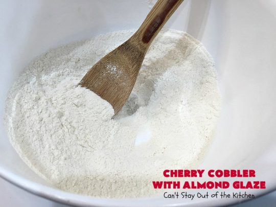Cherry Cobbler with Almond Glaze | Can't Stay Out of the Kitchen | This lovely #dessert is actually assembled in layers that you don't stir together. It's terrific for #summer #holidays, backyard BBQs & potlucks while #FreshCherries are still in season. #cherries #CherryCobbler #cobbler #CherryDessert #CherryCobblerWithAlmondGlaze #Canbassador #NWCherries #NorthWestCherryGrowers #FavoriteCherryCobbler