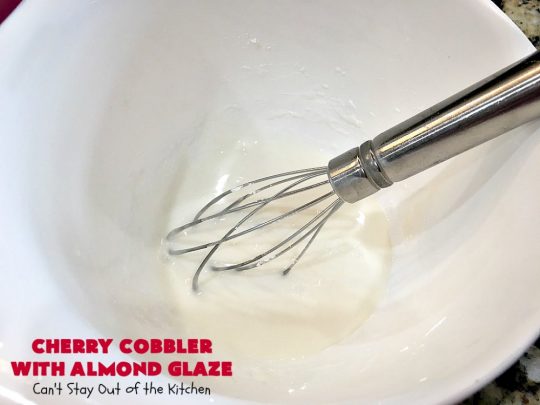 Cherry Cobbler with Almond Glaze | Can't Stay Out of the Kitchen | This lovely #dessert is actually assembled in layers that you don't stir together. It's terrific for #summer #holidays, backyard BBQs & potlucks while #FreshCherries are still in season. #cherries #CherryCobbler #cobbler #CherryDessert #CherryCobblerWithAlmondGlaze #Canbassador #NWCherries #NorthWestCherryGrowers #FavoriteCherryCobbler