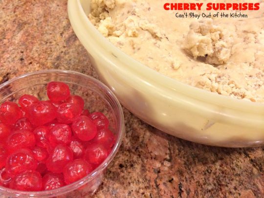 Cherry Surprises | Can't Stay Out of the Kitchen | these melt-in-your-mouth #cookies are absolutely spectacular. #CandiedCherries are hidden inside each #cookie before #baking. Then they're rolled in powdered sugar to serve. These heavenly cookies have been on our #ChristmasCookie baking list for decades! #dessert #Christmas #ChristmasDessert #cherry #CherryDessert #ChristmasCookieExchange