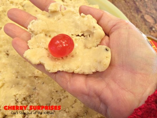 Cherry Surprises | Can't Stay Out of the Kitchen | these melt-in-your-mouth #cookies are absolutely spectacular. #CandiedCherries are hidden inside each #cookie before #baking. Then they're rolled in powdered sugar to serve. These heavenly cookies have been on our #ChristmasCookie baking list for decades! #dessert #Christmas #ChristmasDessert #cherry #CherryDessert #ChristmasCookieExchange