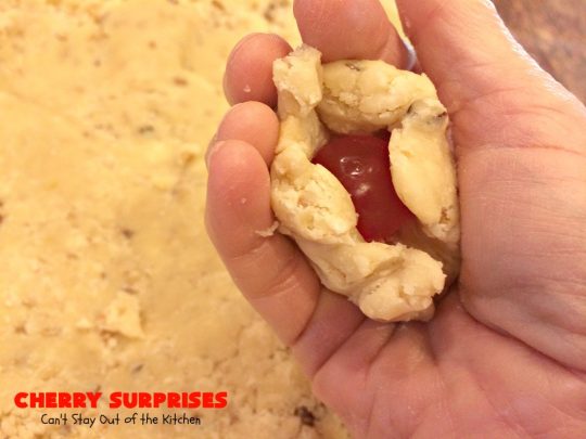 Cherry Surprises | Can't Stay Out of the Kitchen | these melt-in-your-mouth #cookies are absolutely spectacular. #CandiedCherries are hidden inside each #cookie before #baking. Then they're rolled in powdered sugar to serve. These heavenly cookies have been on our #ChristmasCookie baking list for decades! #dessert #Christmas #ChristmasDessert #cherry #CherryDessert #ChristmasCookieExchange