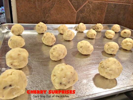 Cherry Surprises | Can't Stay Out of the Kitchen | these melt-in-your-mouth #cookies are absolutely spectacular. #CandiedCherries are hidden inside each #cookie before #baking. Then they're rolled in powdered sugar to serve. These heavenly cookies have been on our #ChristmasCookie baking list for decades! #dessert #Christmas #ChristmasDessert #cherry #CherryDessert #ChristmasCookieExchange