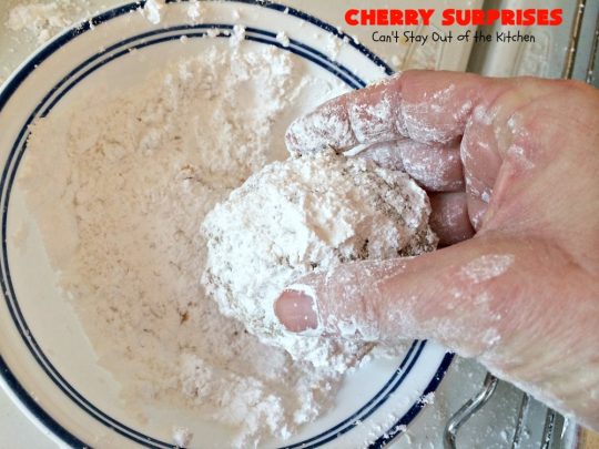 Cherry Surprises | Can't Stay Out of the Kitchen | these melt-in-your-mouth #cookies are absolutely spectacular. #CandiedCherries are hidden inside each #cookie before #baking. Then they're rolled in powdered sugar to serve. These heavenly cookies have been on our #ChristmasCookie baking list for decades! #dessert #Christmas #ChristmasDessert #cherry #CherryDessert #ChristmasCookieExchange
