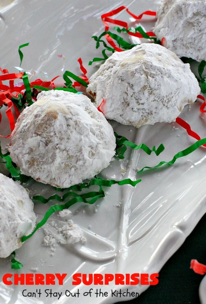 Cherry Surprises | Can't Stay Out of the Kitchen | these melt-in-your-mouth #cookies are absolutely spectacular. #CandiedCherries are hidden inside each #cookie before #baking. Then they're rolled in powdered sugar to serve. These heavenly cookies have been on our #ChristmasCookie baking list for decades! #dessert #Christmas #ChristmasDessert #cherry #CherryDessert #ChristmasCookieExchange