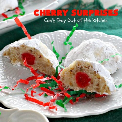 Cherry Surprises | Can't Stay Out of the Kitchen | these melt-in-your-mouth #cookies are absolutely spectacular. #CandiedCherries are hidden inside each #cookie before #baking. Then they're rolled in powdered sugar to serve. These heavenly cookies have been on our #ChristmasCookie baking list for decades! #dessert #Christmas #ChristmasDessert #cherry #CherryDessert #ChristmasCookieExchange