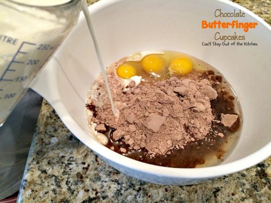 Chocolate Butterfinger Cupcakes | Can't Stay Out of the Kitchen | these fantastic #chocolate #cupcakes are filled with #ButterfingerBites and spread with #Hershey's dark roast chocolate frosting then they're sprinkled with more #butterfinger deliciousness on top! #dessert