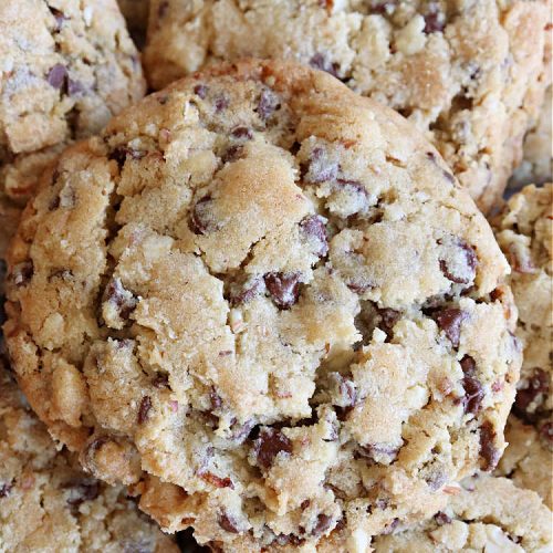Chocolate Chip Almond Cookies | Can't Stay Out of the Kitchen | these fantastic #cookies are divine! They include 2 bags of miniature #ChocolateChips & chopped #almonds. They're crunchy, chocolaty and mammoth-sized. Wonderful for #tailgating or office parties, potlucks, soccer or hockey practice for your kids or backyard BBQs. Every bite is just perfect! #dessert #ChocolateDessert #chocolate #AlmondDessert #ChristmasCookieExchange #ChocolateChipAlmondCookies