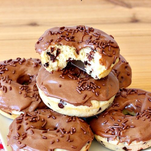 Chocolate Chip Donuts | Can't Stay Out of the Kitchen | these spectacular #donuts are filled with miniature #ChocolateChips. They're glazed with a #chocolate icing and sprinkled with chocolate #sprinkles on top. Mouthwatering #breakfast for #holidays like #MothersDay or #FathersDay. #HolidayBreakfast #FathersDayBreakfast #MothersDayBreakfast #ChocolateChipDonuts