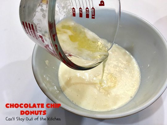 Chocolate Chip Donuts | Can't Stay Out of the Kitchen | these spectacular #donuts are filled with miniature #ChocolateChips. They're glazed with a #chocolate icing and sprinkled with chocolate #sprinkles on top. Mouthwatering #breakfast for #holidays like #MothersDay or #FathersDay. #HolidayBreakfast #FathersDayBreakfast #MothersDayBreakfast #ChocolateChipDonuts