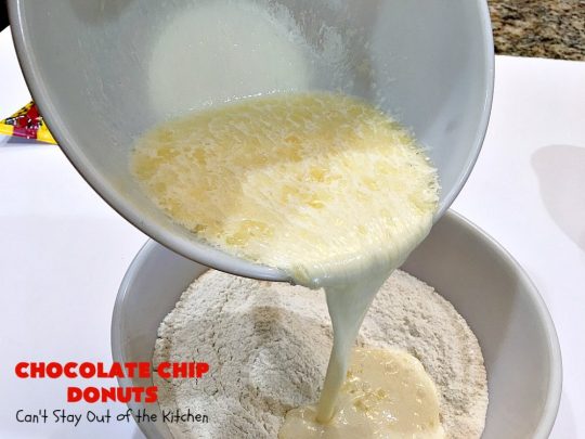 Chocolate Chip Donuts | Can't Stay Out of the Kitchen | these spectacular #donuts are filled with miniature #ChocolateChips. They're glazed with a #chocolate icing and sprinkled with chocolate #sprinkles on top. Mouthwatering #breakfast for #holidays like #MothersDay or #FathersDay. #HolidayBreakfast #FathersDayBreakfast #MothersDayBreakfast #ChocolateChipDonuts