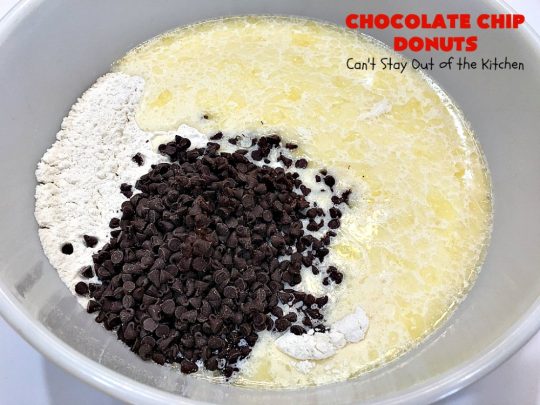 Chocolate Chip Donuts | Can't Stay Out of the Kitchen | these spectacular #donuts are filled with miniature #ChocolateChips. They're glazed with a #chocolate icing and sprinkled with chocolate #sprinkles on top. Mouthwatering #breakfast for #holidays like #MothersDay or #FathersDay. #HolidayBreakfast #FathersDayBreakfast #MothersDayBreakfast #ChocolateChipDonuts