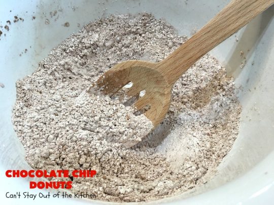 Chocolate Chip Donuts | Can't Stay Out of the Kitchen | these spectacular #donuts are filled with miniature #ChocolateChips. They're glazed with a #chocolate icing and sprinkled with chocolate #sprinkles on top. Mouthwatering #breakfast for #holidays like #MothersDay or #FathersDay. #HolidayBreakfast #FathersDayBreakfast #MothersDayBreakfast #ChocolateChipDonuts