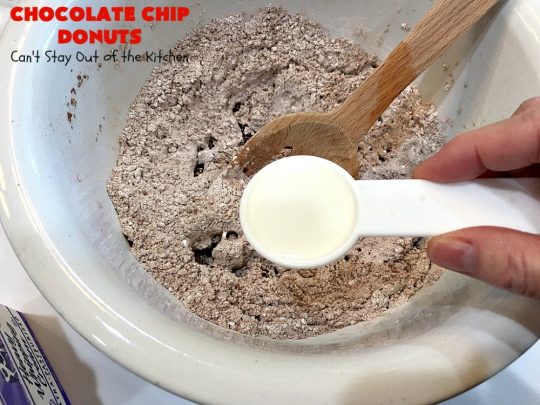 Chocolate Chip Donuts | Can't Stay Out of the Kitchen | these spectacular #donuts are filled with miniature #ChocolateChips. They're glazed with a #chocolate icing and sprinkled with chocolate #sprinkles on top. Mouthwatering #breakfast for #holidays like #MothersDay or #FathersDay. #HolidayBreakfast #FathersDayBreakfast #MothersDayBreakfast #ChocolateChipDonuts