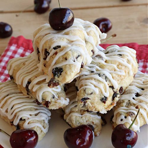 Chocolate Chip Dried Cherry Scones | Can't Stay Out of the Kitchen | these fabulous #scones are filled with #ChocolateChips & #DriedCherries. The texture is softer and the scones are glazed with a rich, powdered sugar icing which makes them sweet & irresistible. Great #breakfast treat for weekends, company or a #holiday breakfast. Prepare to swoon from the first bite! #ChocolateChipDriedCherryScones #chocolate