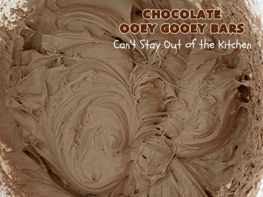 Chocolate Ooey Gooey Bars | Can't Stay Out of the Kitchen | You'll be raving over every drool-worthy bite of these fantastic #OoeyGooeyBars. They're made with 3 kinds of #chocolate & just ooze deliciousness in every bite. The #Cheesecake layer alone will leave you swooning! #cookie #brownie #tailgating #dessert, #CreamCheese #ChocolateChips #ChocolateDessert #HolidayDessert #OoeyGooeyDessert #ChocolateOoeyGooeyBars