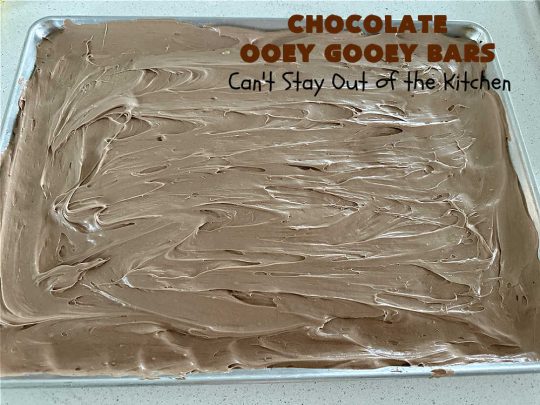 Chocolate Ooey Gooey Bars | Can't Stay Out of the Kitchen | You'll be raving over every drool-worthy bite of these fantastic #OoeyGooeyBars. They're made with 3 kinds of #chocolate & just ooze deliciousness in every bite. The #Cheesecake layer alone will leave you swooning! #cookie #brownie #tailgating #dessert, #CreamCheese #ChocolateChips #ChocolateDessert #HolidayDessert #OoeyGooeyDessert #ChocolateOoeyGooeyBars