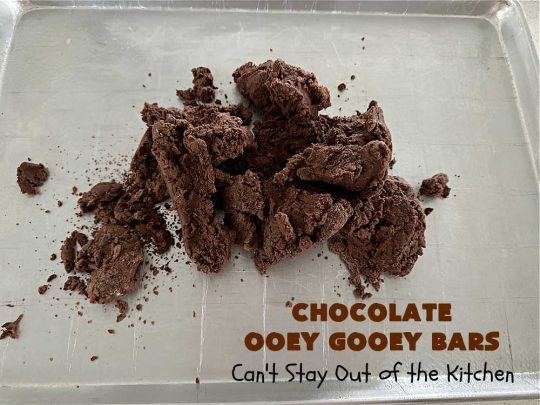 Chocolate Ooey Gooey Bars | Can't Stay Out of the Kitchen | You'll be raving over every drool-worthy bite of these fantastic #OoeyGooeyBars. They're made with 3 kinds of #chocolate & just ooze deliciousness in every bite. The #Cheesecake layer alone will leave you swooning! #cookie #brownie #tailgating #dessert, #CreamCheese #ChocolateChips #ChocolateDessert #HolidayDessert #OoeyGooeyDessert #ChocolateOoeyGooeyBars