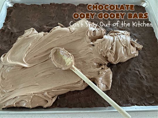 Chocolate Ooey Gooey Bars | Can't Stay Out of the Kitchen | You'll be raving over every drool-worthy bite of these fantastic #OoeyGooeyBars. They're made with 3 kinds of #chocolate & just ooze deliciousness in every bite. The #Cheesecake layer alone will leave you swooning! #cookie #brownie #tailgating #dessert, #CreamCheese #ChocolateChips #ChocolateDessert #HolidayDessert #OoeyGooeyDessert #ChocolateOoeyGooeyBars