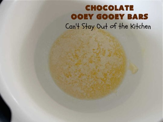 Chocolate Ooey Gooey Bars | Can't Stay Out of the Kitchen | You'll be raving over every drool-worthy bite of these fantastic #OoeyGooeyBars. They're made with 3 kinds of #chocolate & just ooze deliciousness in every bite. The #Cheesecake layer alone will leave you swooning! #cookie #brownie #tailgating #dessert, #CreamCheese #ChocolateChips #ChocolateDessert #HolidayDessert #OoeyGooeyDessert #ChocolateOoeyGooeyBars