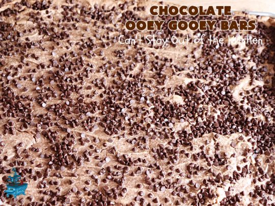 Chocolate Ooey Gooey Bars | Can't Stay Out of the Kitchen | You'll be raving over every drool-worthy bite of these fantastic #OoeyGooeyBars. They're made with 3 kinds of #chocolate & just ooze deliciousness in every bite. The #Cheesecake layer alone will leave you swooning! #cookie #brownie #tailgating #dessert, #CreamCheese #ChocolateChips #ChocolateDessert #HolidayDessert #OoeyGooeyDessert #ChocolateOoeyGooeyBars