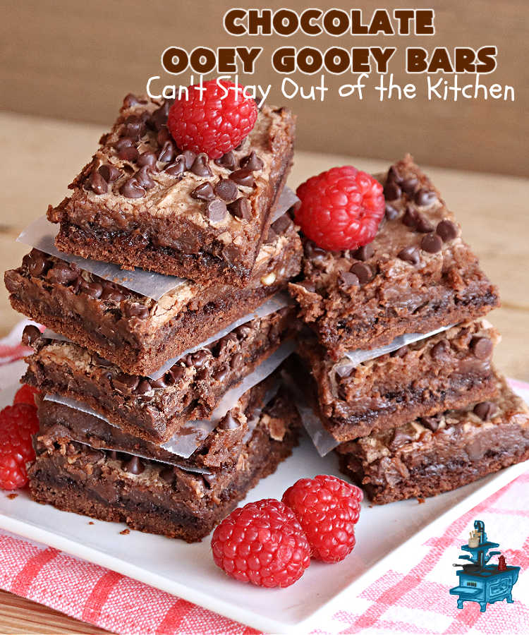 Chocolate Ooey Gooey Bars | Can't Stay Out of the Kitchen | You'll be raving over every drool-worthy bite of these fantastic #OoeyGooeyBars. They're made with 3 kinds of #chocolate & just ooze deliciousness in every bite. The #Cheesecake layer alone will leave you swooning! #cookie #brownie #tailgating #dessert, #CreamCheese #ChocolateChips #ChocolateDessert #HolidayDessert #OoeyGooeyDessert #ChocolateOoeyGooeyBars