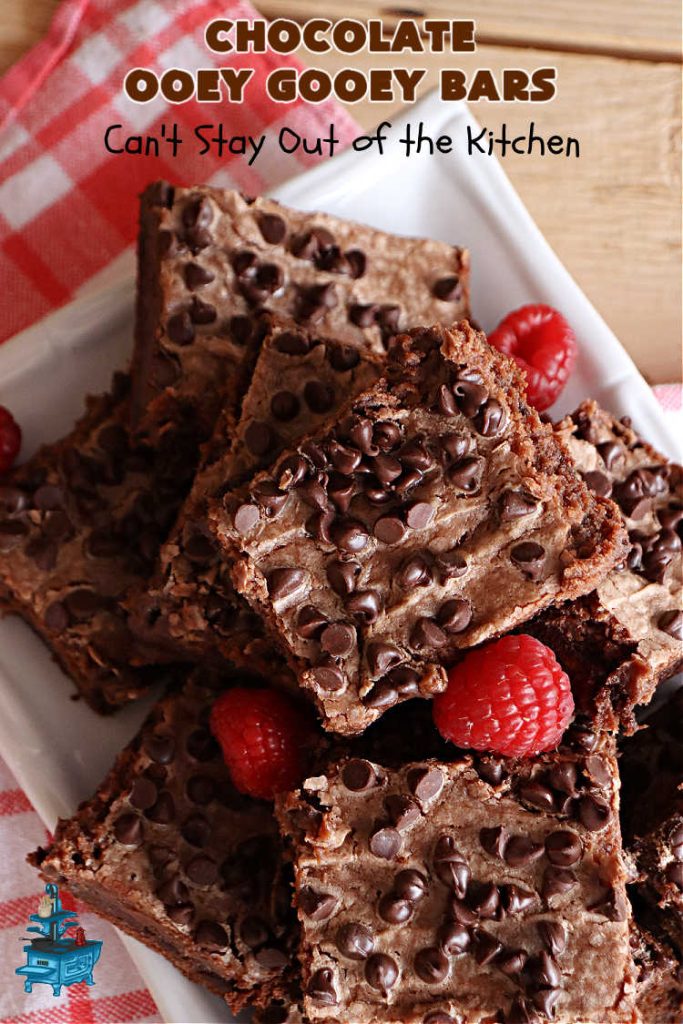 Chocolate Ooey Gooey Bars | Can't Stay Out of the Kitchen | You'll be raving over every drool-worthy bite of these fantastic #OoeyGooeyBars. They're made with 3 kinds of #chocolate & just ooze deliciousness in every bite. The #Cheesecake layer alone will leave you swooning! #cookie #brownie #tailgating #dessert, #CreamCheese #ChocolateChips #ChocolateDessert #HolidayDessert #OoeyGooeyDessert #ChocolateOoeyGooeyBars