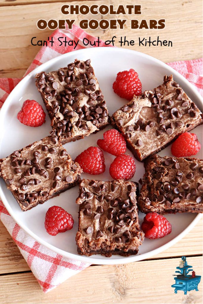 Chocolate Ooey Gooey Bars | Can't Stay Out of the Kitchen | You'll be raving over every drool-worthy bite of these fantastic #OoeyGooeyBars. They're made with 3 kinds of #chocolate & just ooze deliciousness in every bite. The #Cheesecake layer alone will leave you swooning! #cookie #brownie #tailgating #dessert, #CreamCheese #ChocolateChips #ChocolateDessert #HolidayDessert #OoeyGooeyDessert #ChocolateOoeyGooeyBars