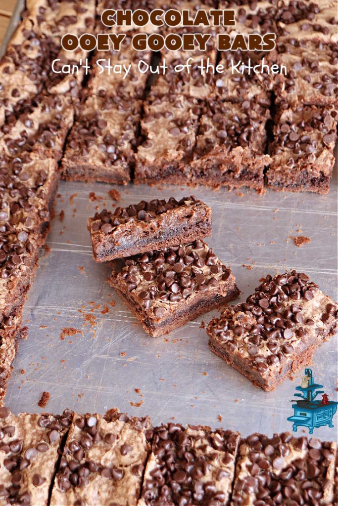Chocolate Ooey Gooey Bars | Can't Stay Out of the Kitchen | You'll be raving over every drool-worthy bite of these fantastic #OoeyGooeyBars. They're made with 3 kinds of #chocolate & just ooze deliciousness in every bite. The #Cheesecake layer alone will leave you swooning! #cookie #brownie #tailgating #dessert, #CreamCheese #ChocolateChips #ChocolateDessert #HolidayDessert #OoeyGooeyDessert #ChocolateOoeyGooeyBars
