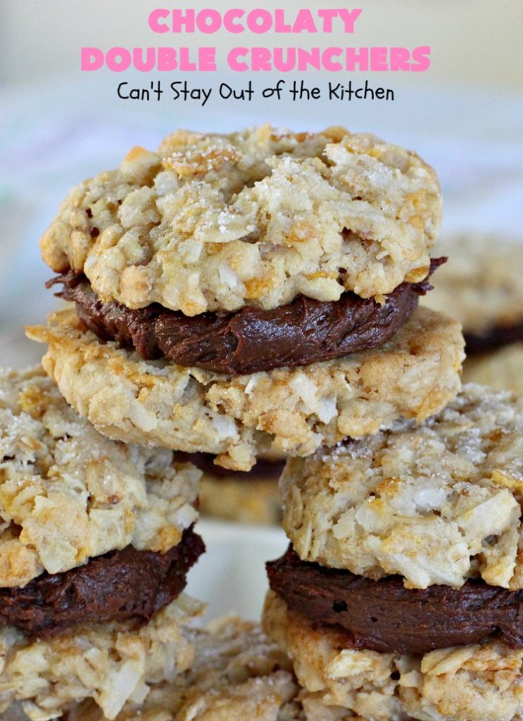 Chocolaty Double Crunchers | Can't Stay Out of the Kitchen | this scrumptious #cookie #recipe is to die for! The cookies contain #oatmeal, #CornFlakes & #coconut. The #chocolate frosting is made from #ChocolateChips & #CreamCheese. Absolutely mouthwatering #dessert for #tailgating, potlucks or #ChristmasCookieExchanges. #ChocolateDessert #WhoopiePie #OatmealWhoopiePie#ChocolatyDoubleCrunchers #SandwichCookie #OatmealSandwichCookie