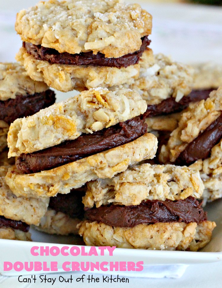 Chocolaty Double Crunchers | Can't Stay Out of the Kitchen | this scrumptious #cookie #recipe is to die for! The cookies contain #oatmeal, #CornFlakes & #coconut. The #chocolate frosting is made from #ChocolateChips & #CreamCheese. Absolutely mouthwatering #dessert for #tailgating, potlucks or #ChristmasCookieExchanges. #ChocolateDessert #WhoopiePie #OatmealWhoopiePie#ChocolatyDoubleCrunchers #SandwichCookie #OatmealSandwichCookie