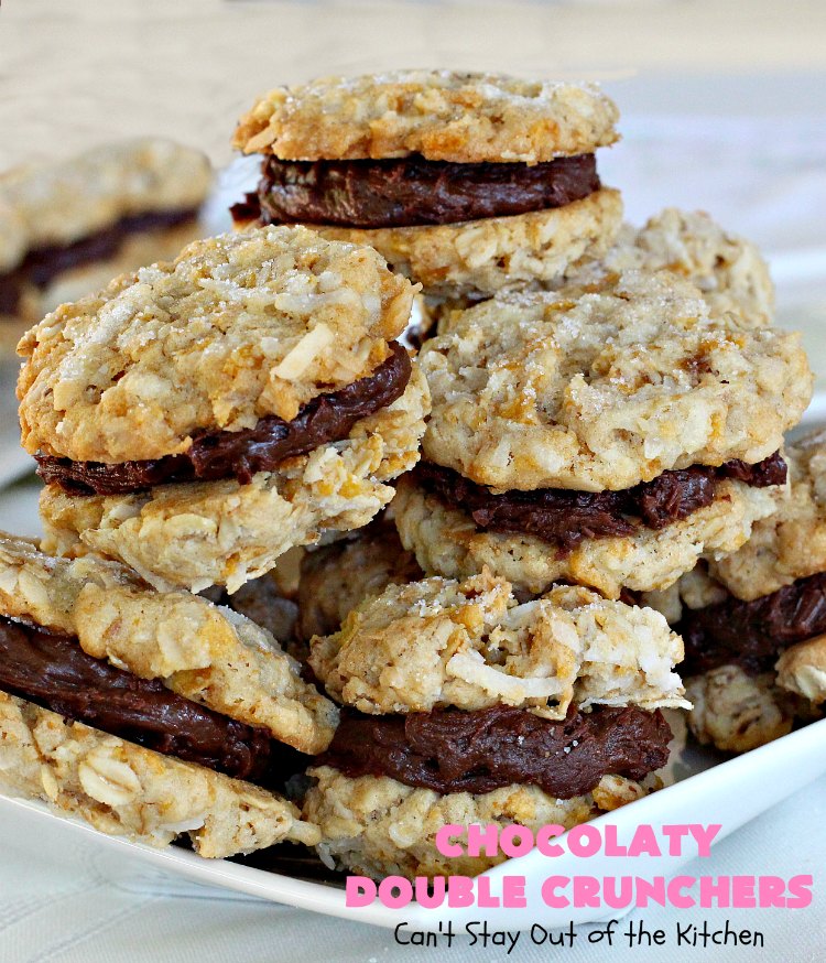 Chocolaty Double Crunchers | Can't Stay Out of the Kitchen | this scrumptious #cookie #recipe is to die for! The cookies contain #oatmeal, #CornFlakes & #coconut. The #chocolate frosting is made from #ChocolateChips & #CreamCheese. Absolutely mouthwatering #dessert for #tailgating, potlucks or #ChristmasCookieExchanges. #ChocolateDessert #WhoopiePie #OatmealWhoopiePie#ChocolatyDoubleCrunchers #SandwichCookie #OatmealSandwichCookie